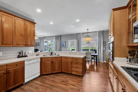 a large kitchen with a large window