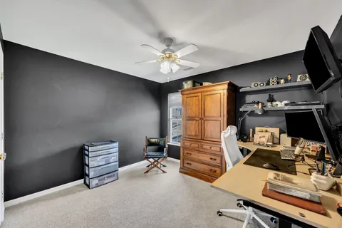a room with furniture and a flat screen tv