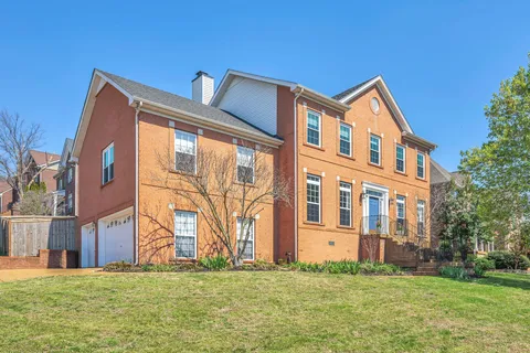 a front view of building with yard