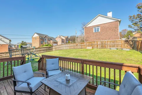 a balcony with table and chairs