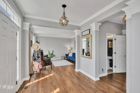 a view of a livingroom with wooden floor