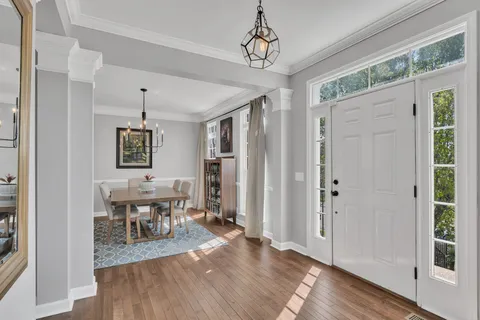 a view of a dining room with furniture window and wooden floor