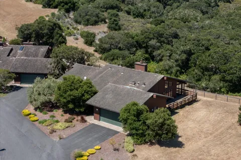 an aerial view of house with yard