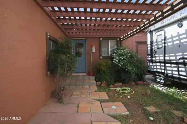 a pathway with a wooden fence