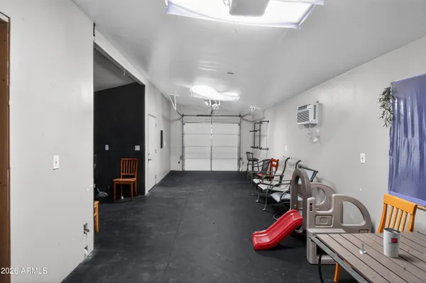 a view of walk in closet with clothes