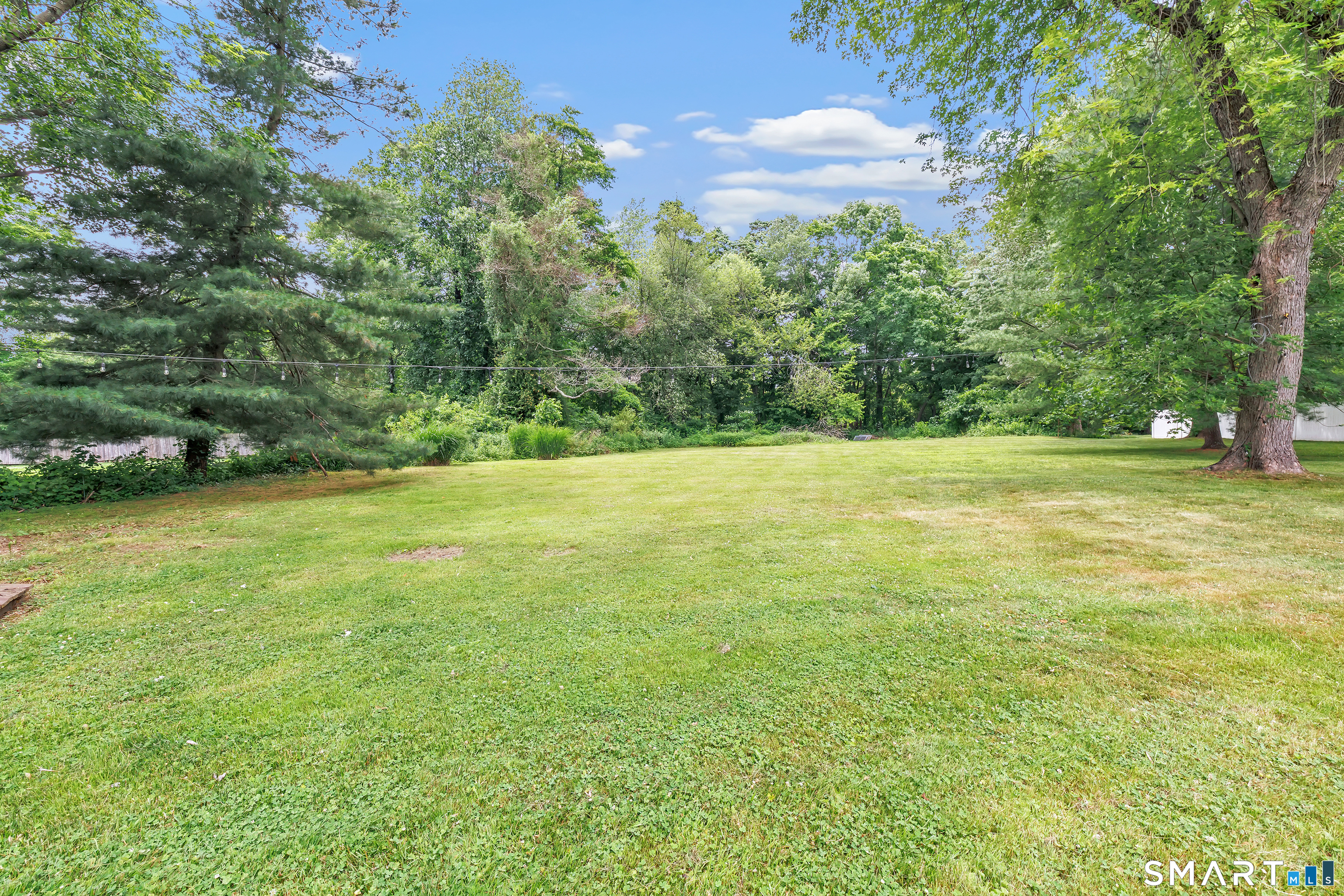 17 Woodlawn Road Monroe, CT 06468 - Photo 5 of 37 Over an acre of sprawling, lush yard with endless outdoor possibilities