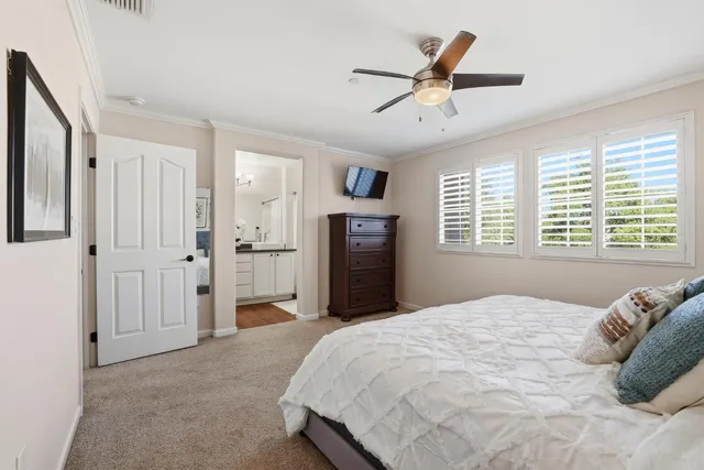 a view of walk in closet with clothes