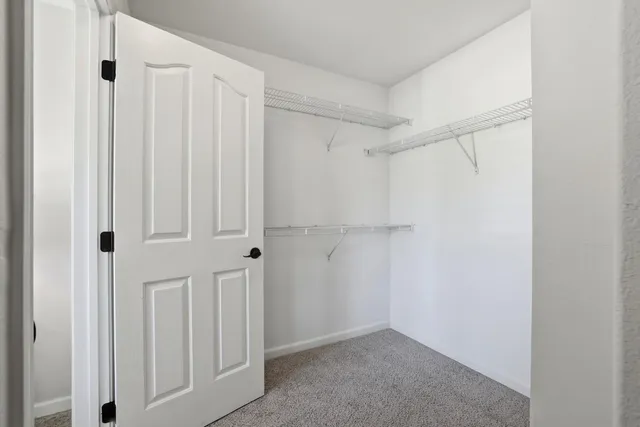 a view of bathroom with toilet shower and wooden floor