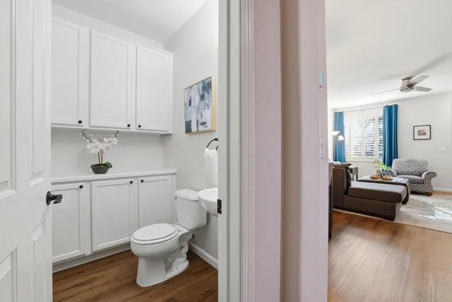 a bathroom with a sink a toilet and mirror