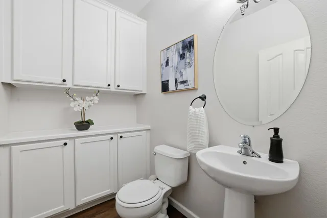 a bathroom with a sink a large mirror and a shower
