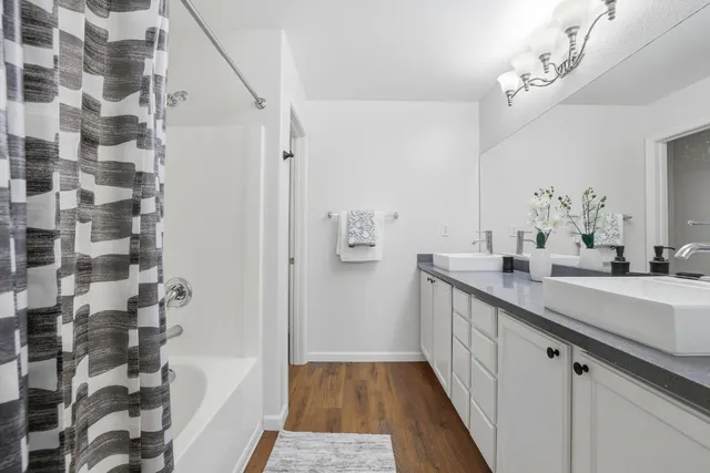 a bathroom with a bathtub and shower