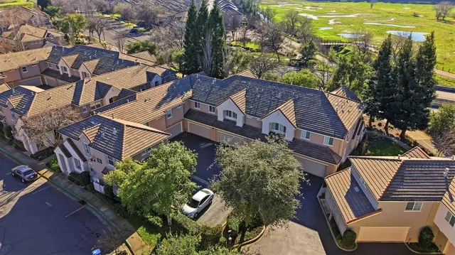 an aerial view of a house with a garden