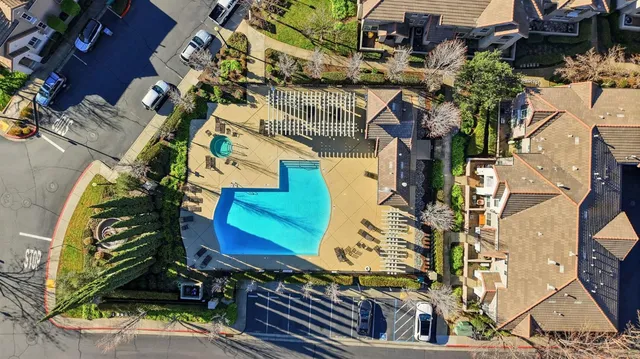 a view of a house with a yard and sitting area