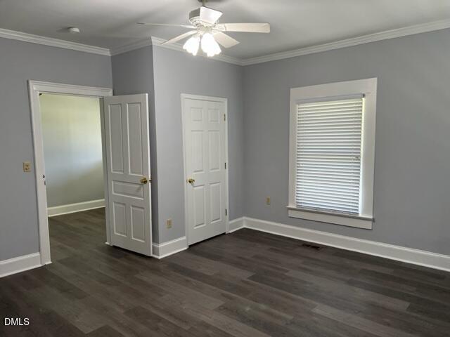 3831 Bizzell Grove Church Road Princeton, NC 27569 - Photo 7 of 17 an empty room with wooden floor closet and windows