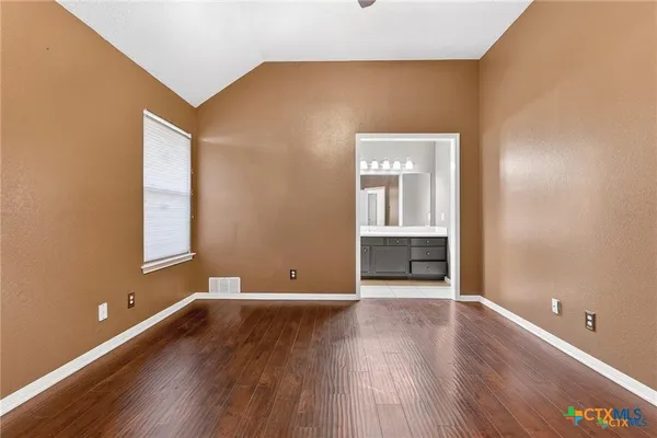 a view of a livingroom with wooden floor