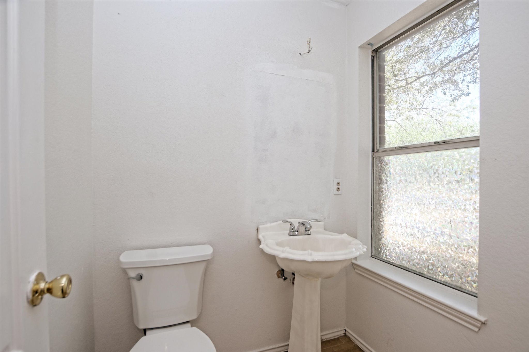 2509 Patsy Parkway Austin, TX 78744 - Photo 13 of 28 a bathroom with a sink toilet and a mirror