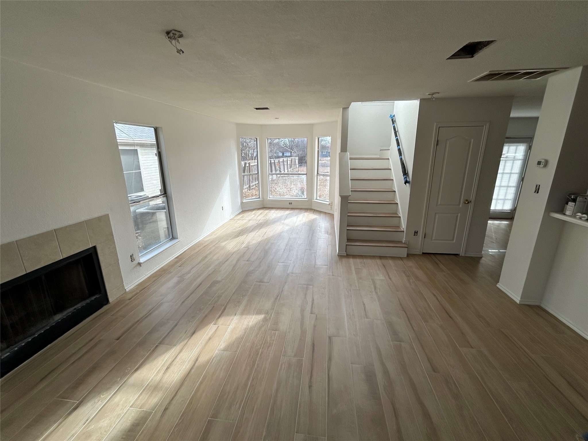 2509 Patsy Parkway Austin, TX 78744 - Photo 2 of 4 a view of empty room with wooden floor and fireplace