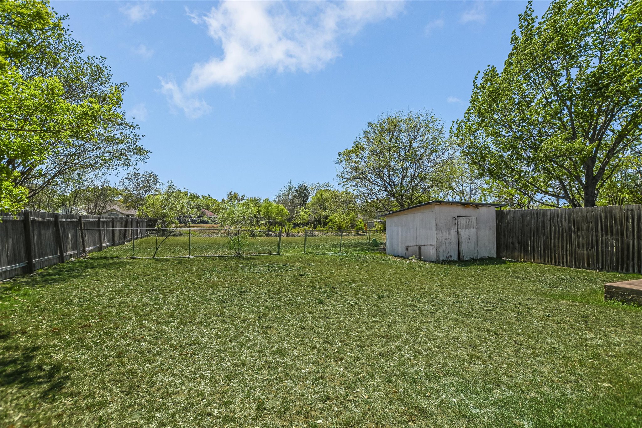 2509 Patsy Parkway Austin, TX 78744 - Photo 23 of 28 a backyard of a house with lots of green space