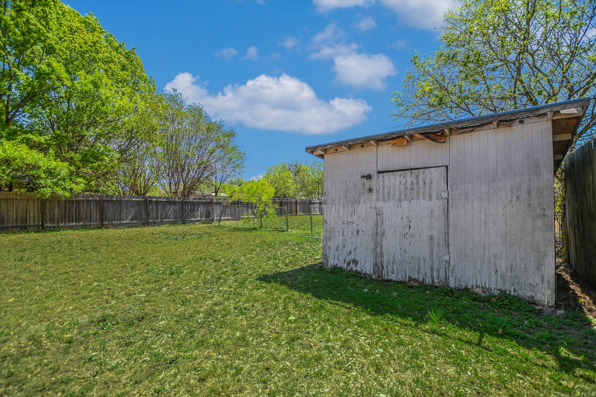 2509 Patsy Parkway Austin, TX 78744 - Photo 24 of 28 a view of a backyard with pathway