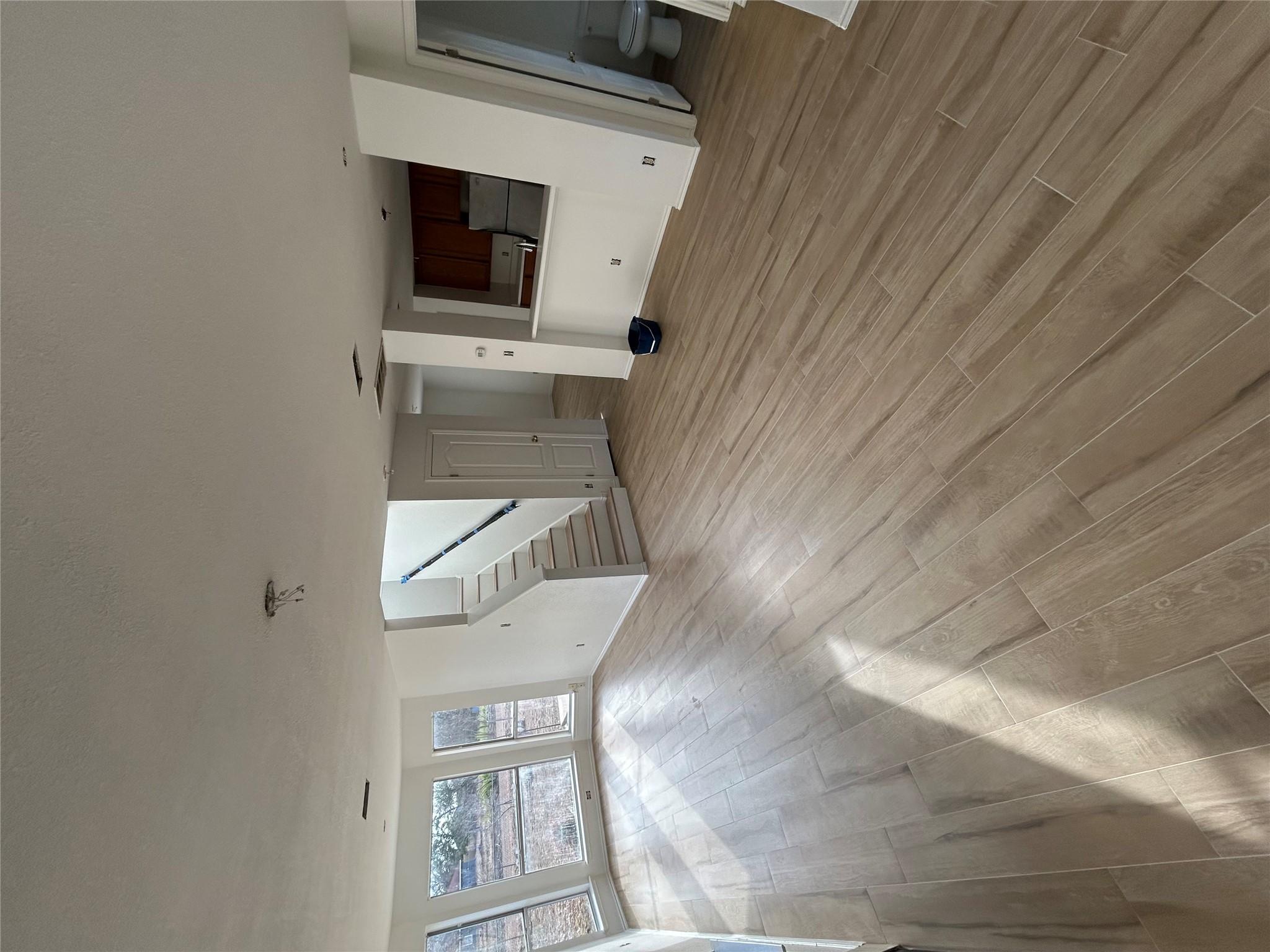 2509 Patsy Parkway Austin, TX 78744 - Photo 4 of 4 a view of an empty room with wooden floor and a window