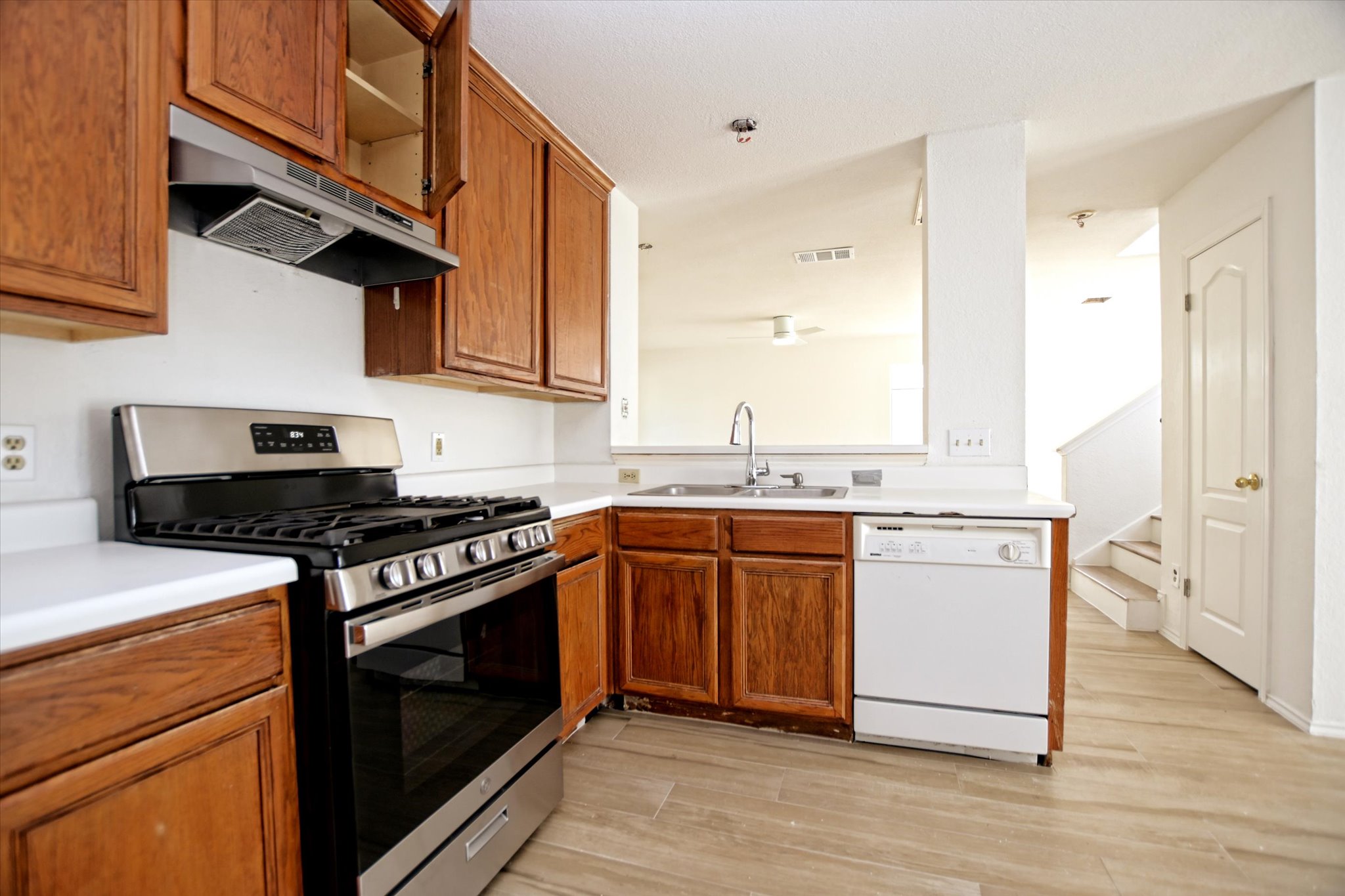 2509 Patsy Parkway Austin, TX 78744 - Photo 10 of 28 a kitchen with stainless steel appliances granite countertop a stove and a sink
