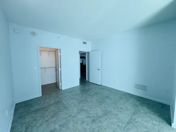 a bathroom with a sink vanity mirror and toilet