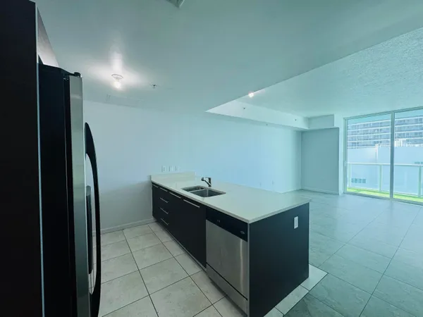 a kitchen with stainless steel appliances a stove and a refrigerator