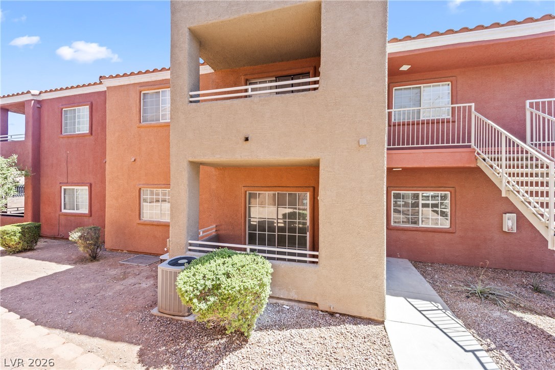 4730 East Craig Road, Unit 1053 Las Vegas, NV 89115 - Photo 23 of 32 Find convenient exterior access to a private balcony and ground-level entrance in this multi-story building.