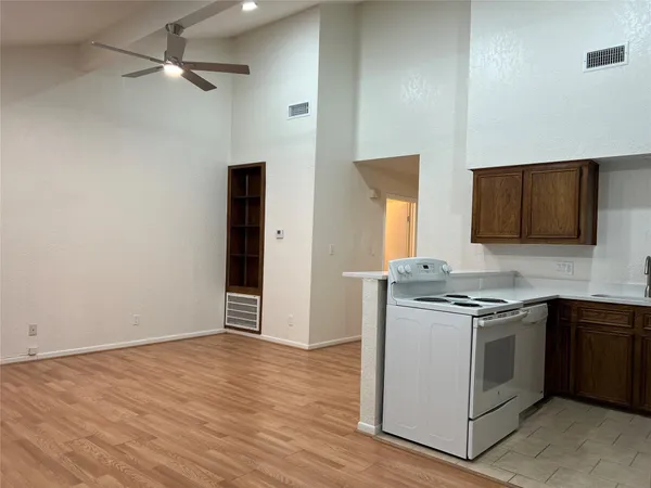 a kitchen with stainless steel appliances granite countertop a stove and a microwave