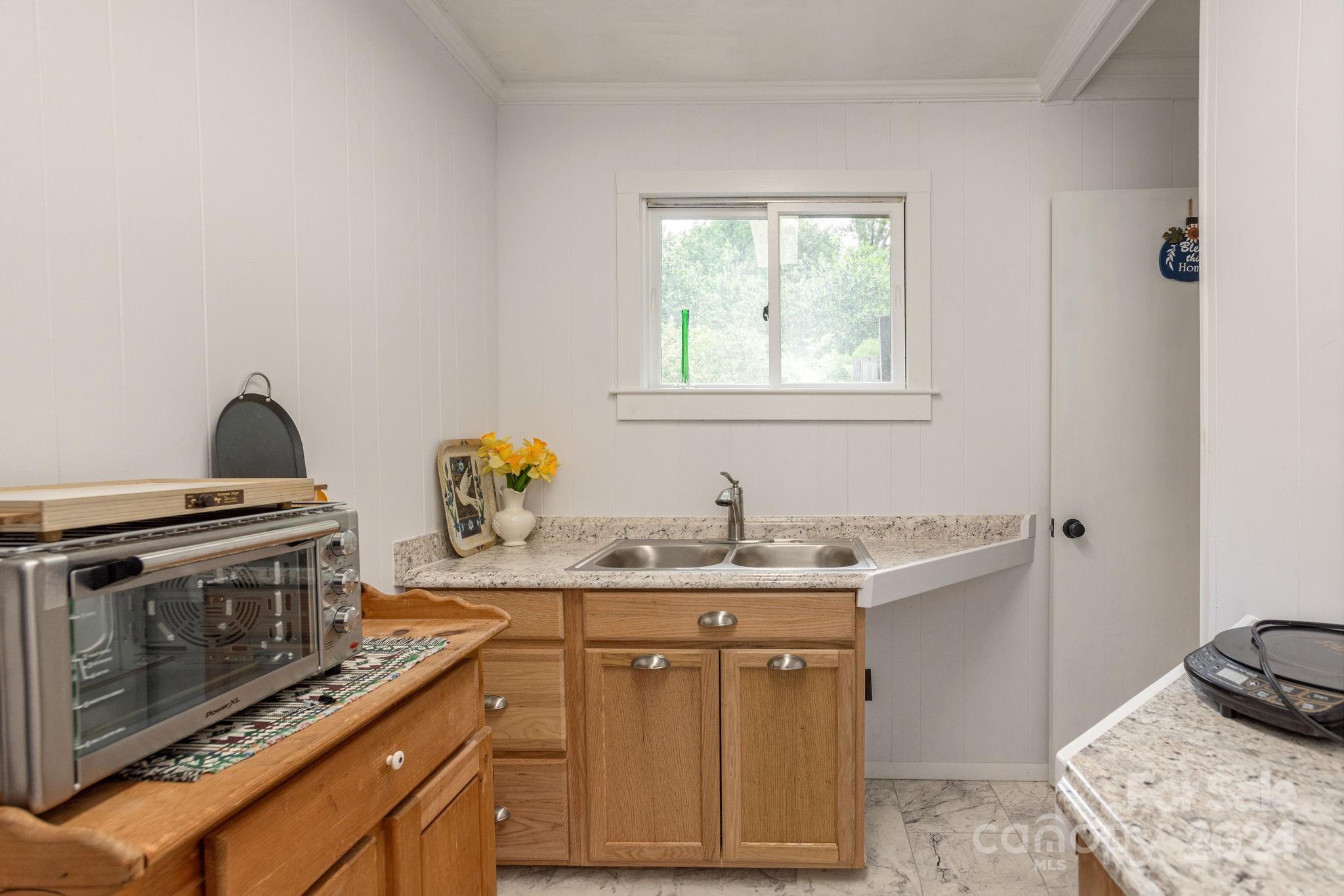 1489 Lynn Road Tryon, NC 28782 - Photo 26 of 46 a kitchen with a stove and a sink