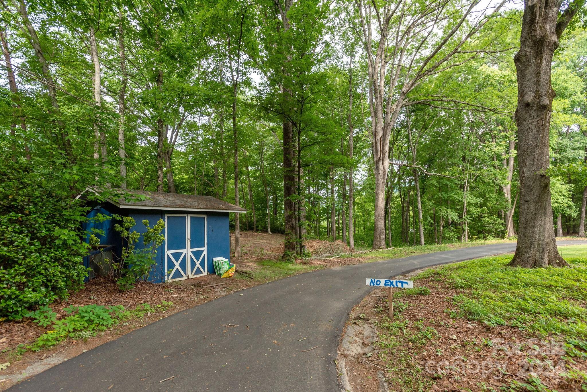 1489 Lynn Road Tryon, NC 28782 - Photo 40 of 46 a front view of a house with a yard