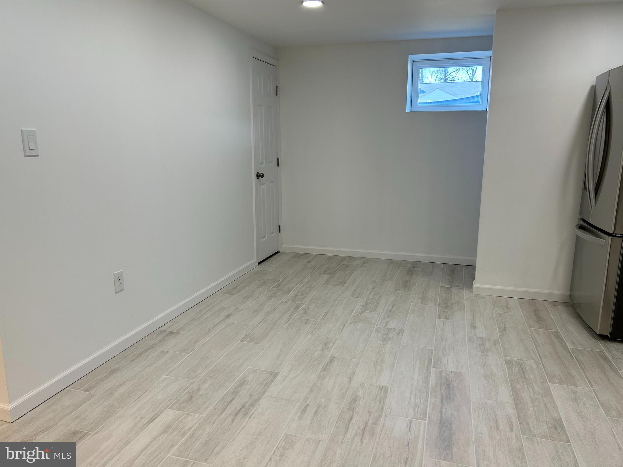 7131 Gormel Drive Springfield, VA 22150 - Photo 14 of 27 a view of room with window and a refrigerator