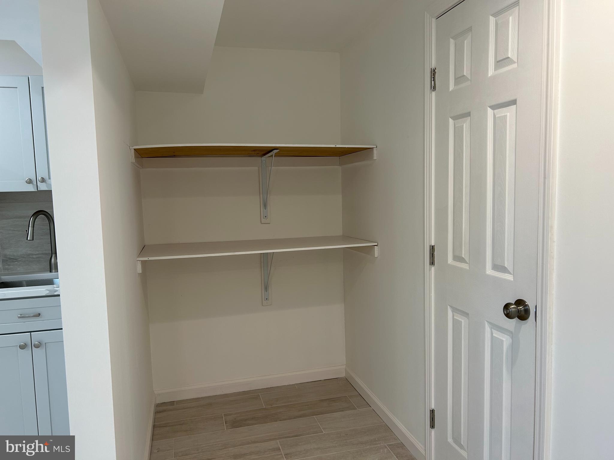 7131 Gormel Drive Springfield, VA 22150 - Photo 23 of 27 a view of walk in closet with empty racks
