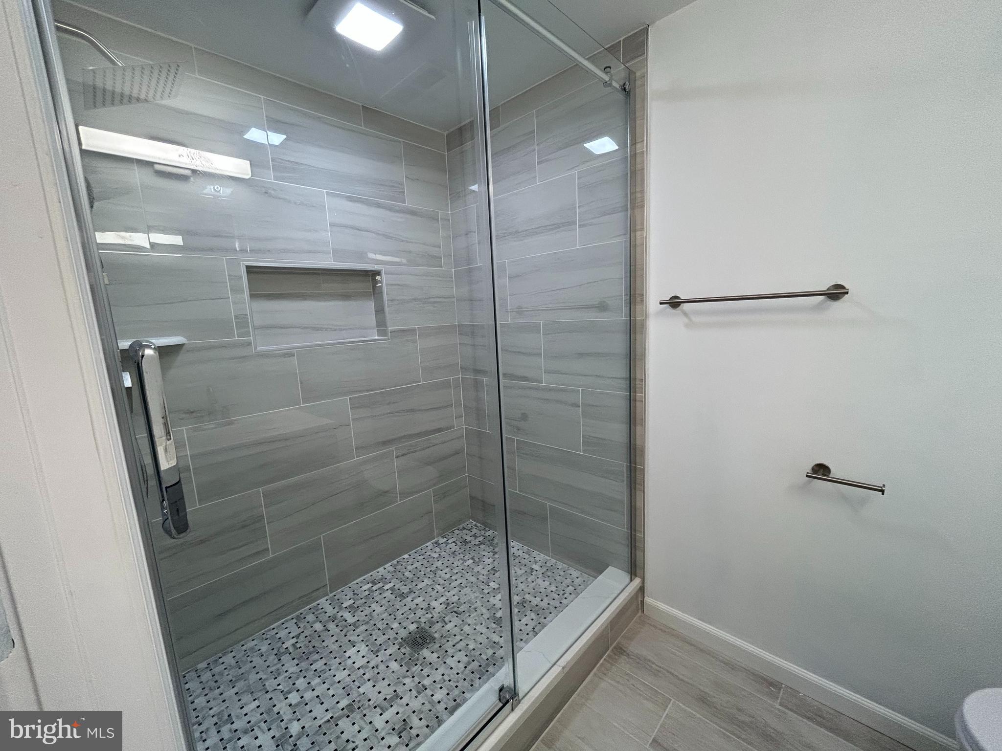 7131 Gormel Drive Springfield, VA 22150 - Photo 9 of 27 a bathroom with a shower