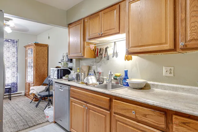 a kitchen with a sink cabinets and window