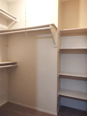 a view of an empty walk in closet