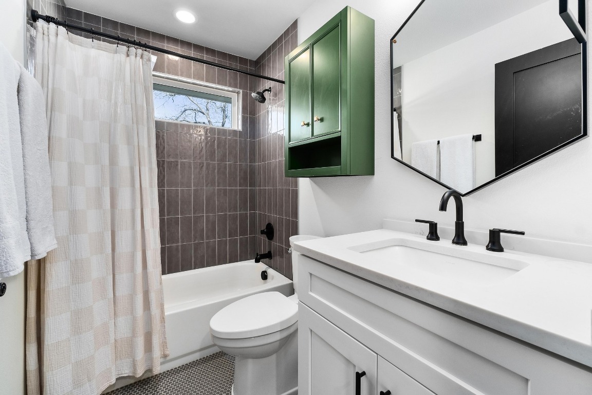3302 Thompson Street, Unit 1 Austin, TX 78702 - Photo 25 of 32 a bathroom with a sink a toilet and shower