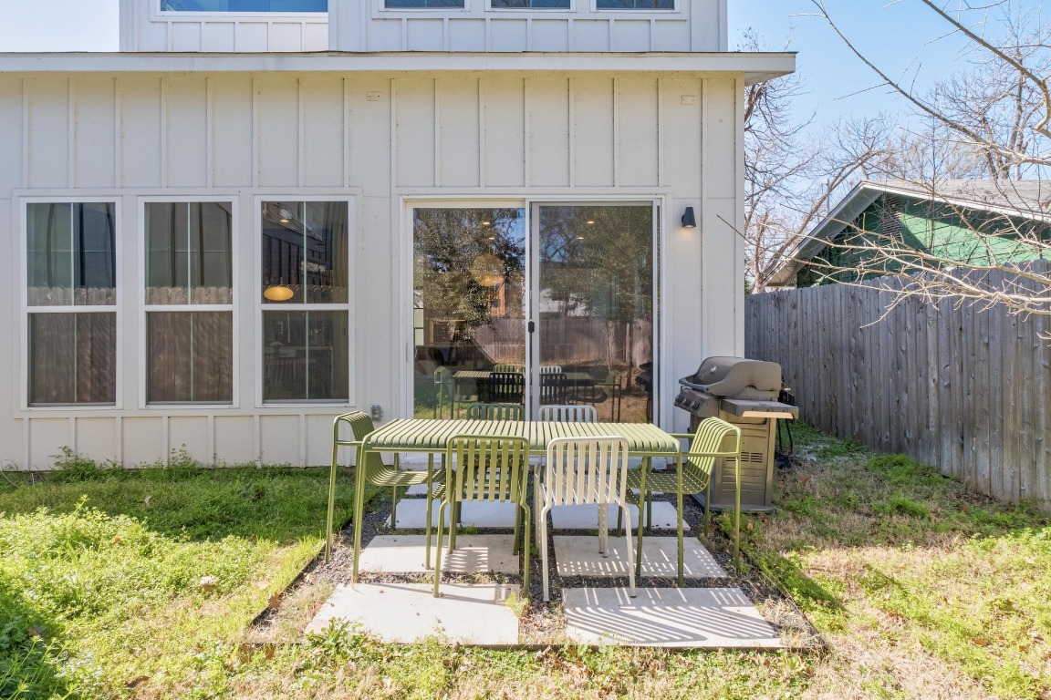 3302 Thompson Street, Unit 1 Austin, TX 78702 - Photo 31 of 32 a view of a chair and table in backyard of the house