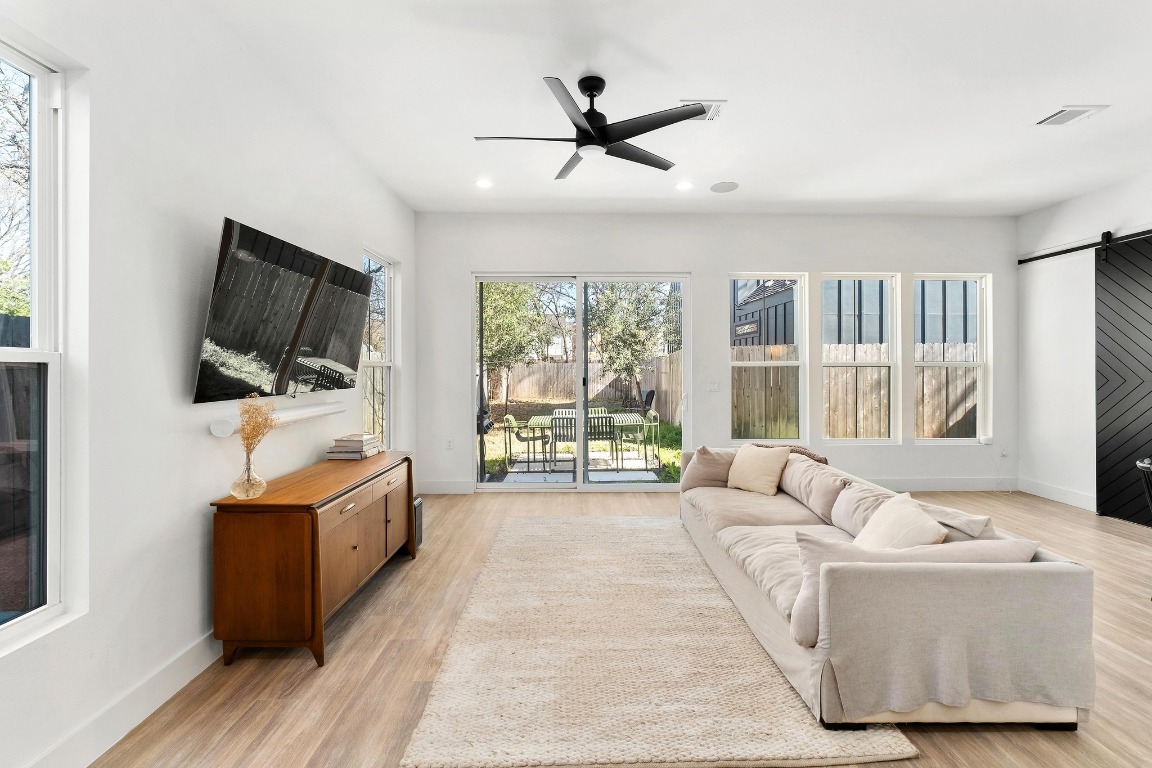 3302 Thompson Street, Unit 1 Austin, TX 78702 - Photo 6 of 32 a living room with furniture and a flat screen tv