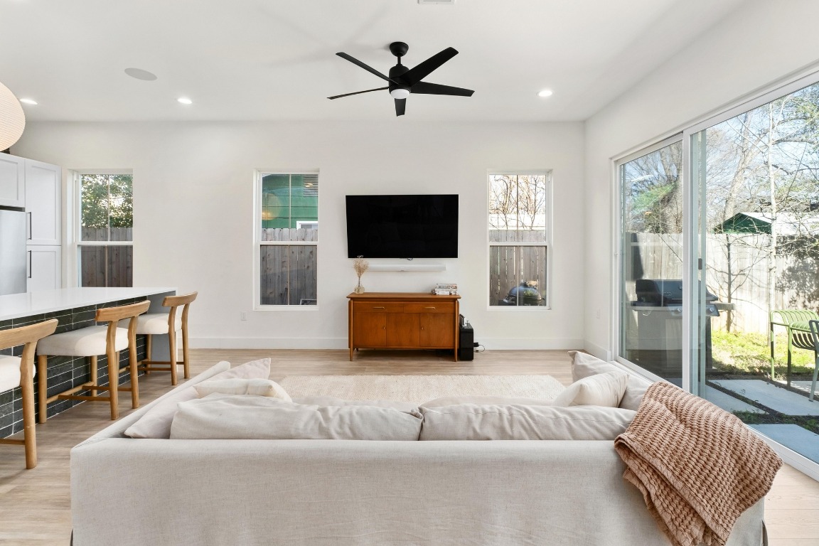 3302 Thompson Street, Unit 1 Austin, TX 78702 - Photo 7 of 32 a living room with furniture and a flat screen tv