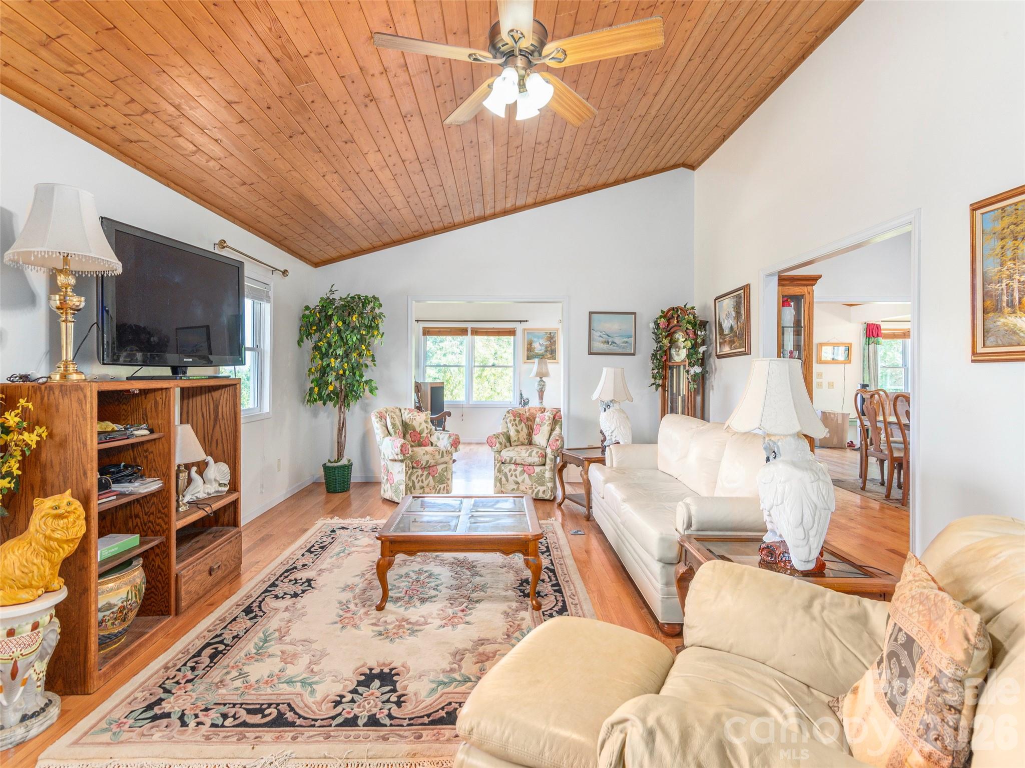 1120 Jacobs Branch Road Franklin, NC 28734 - Photo 9 of 36 a living room with furniture fireplace and a flat screen tv