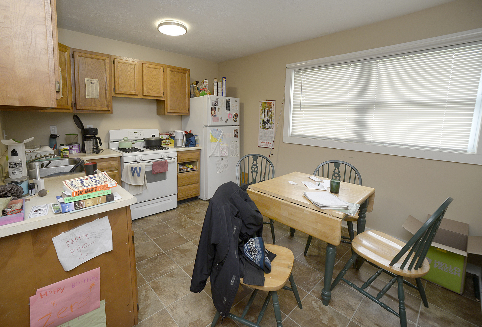 613 Webster Street Ottawa, IL 61350 - Photo 12 of 15 a kitchen with stainless steel appliances a stove a sink a table and chairs
