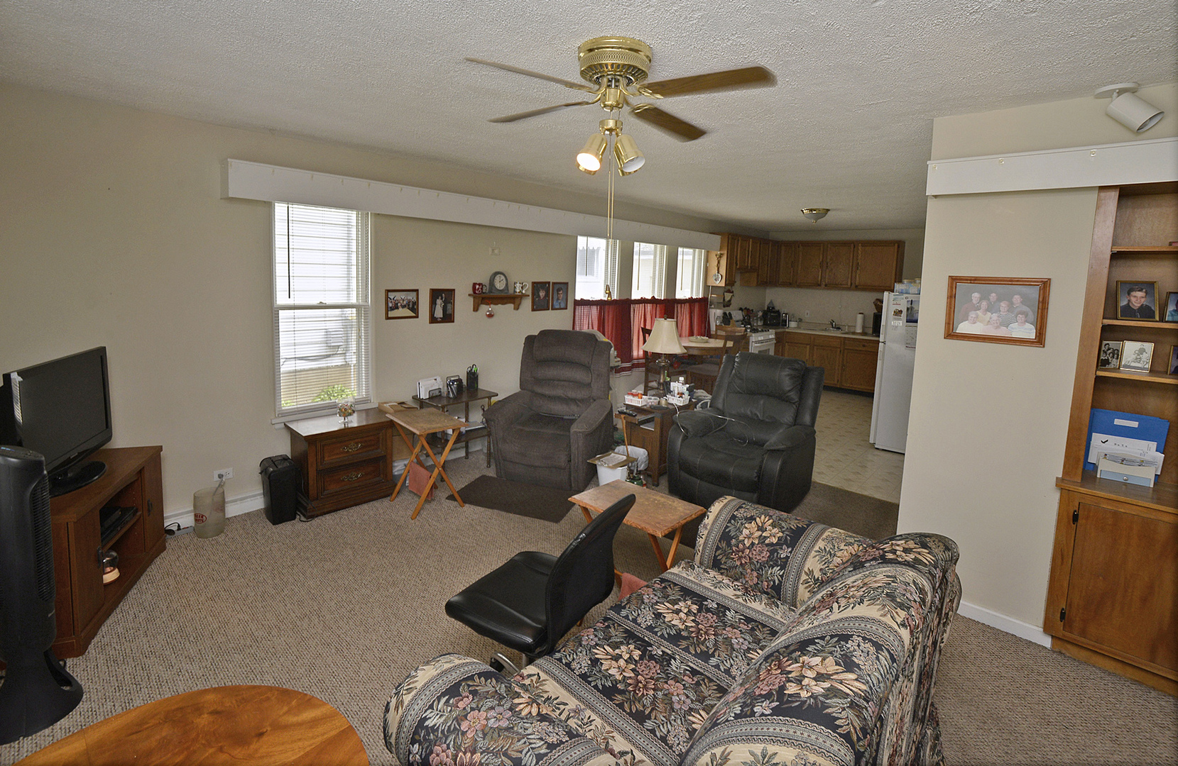 613 Webster Street Ottawa, IL 61350 - Photo 3 of 15 a living room with furniture and a flat screen tv