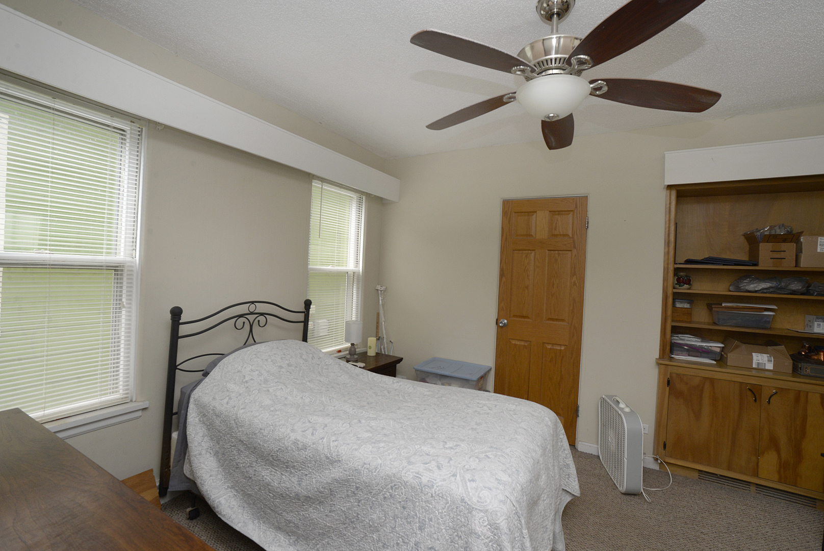 613 Webster Street Ottawa, IL 61350 - Photo 5 of 15 a bedroom with a bed and a ceiling fan