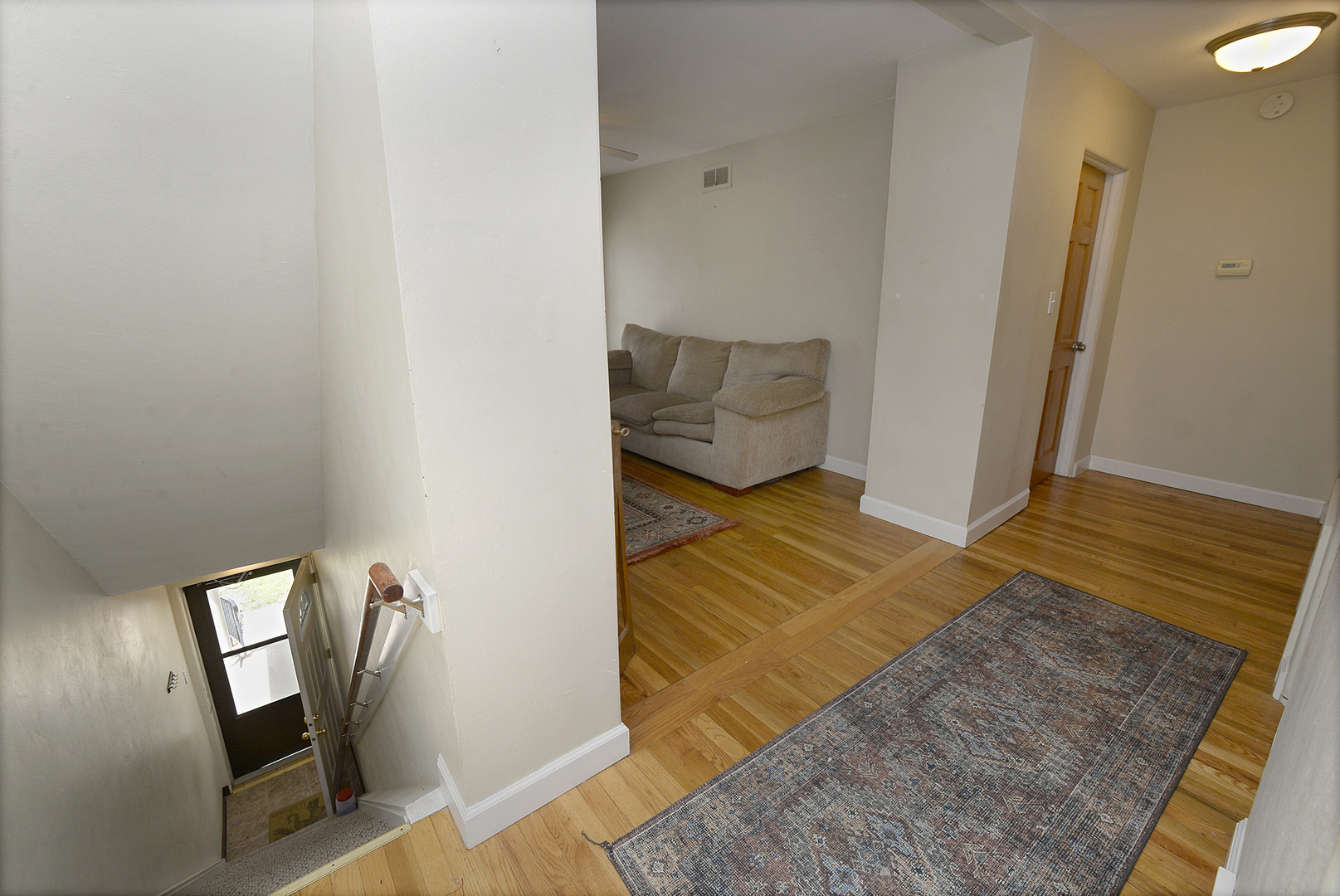 613 Webster Street Ottawa, IL 61350 - Photo 6 of 15 a bedroom with a bed and wooden floor