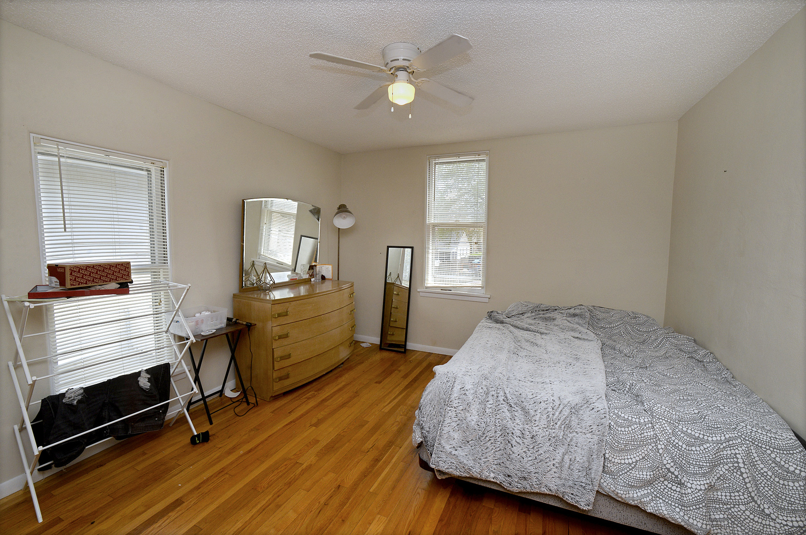 613 Webster Street Ottawa, IL 61350 - Photo 9 of 15 a bedroom with a bed and wooden floor