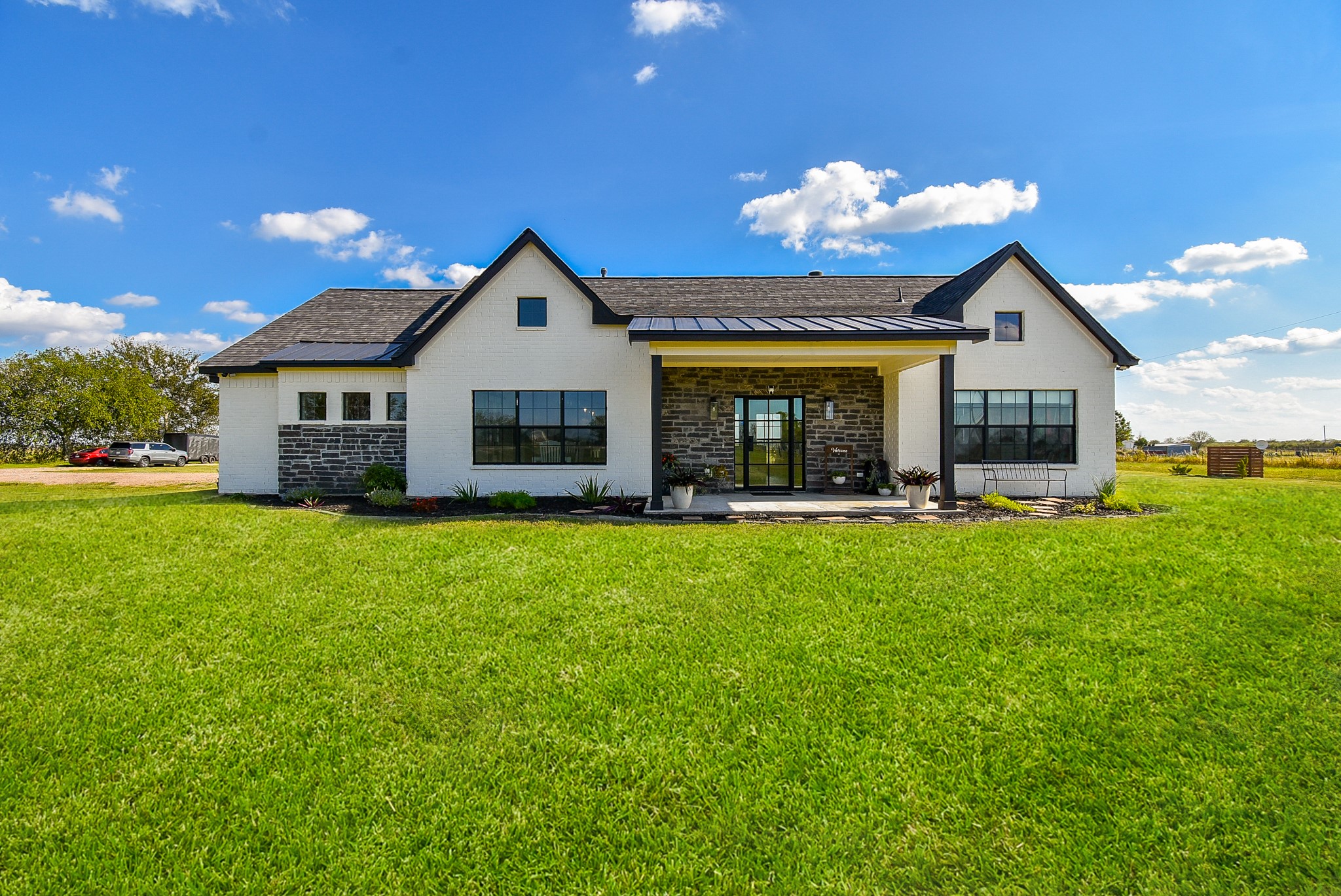 15007 Barak Road Guy, TX 77444 - Photo 2 of 34 a front view of house with yard and outdoor seating