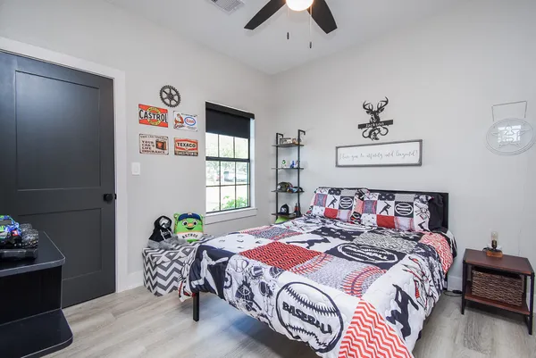 a bedroom with bed and a window