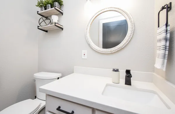 a bathroom with a toilet and a sink