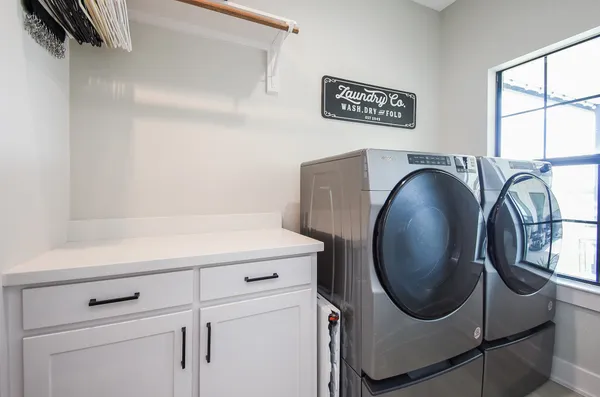 a utility room with dryer and washer